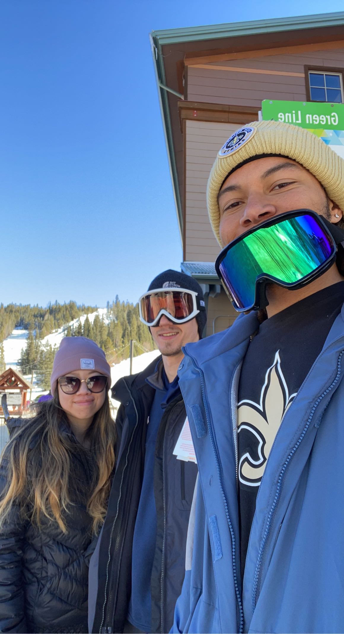 picture of cy with friends wearing snow goggles